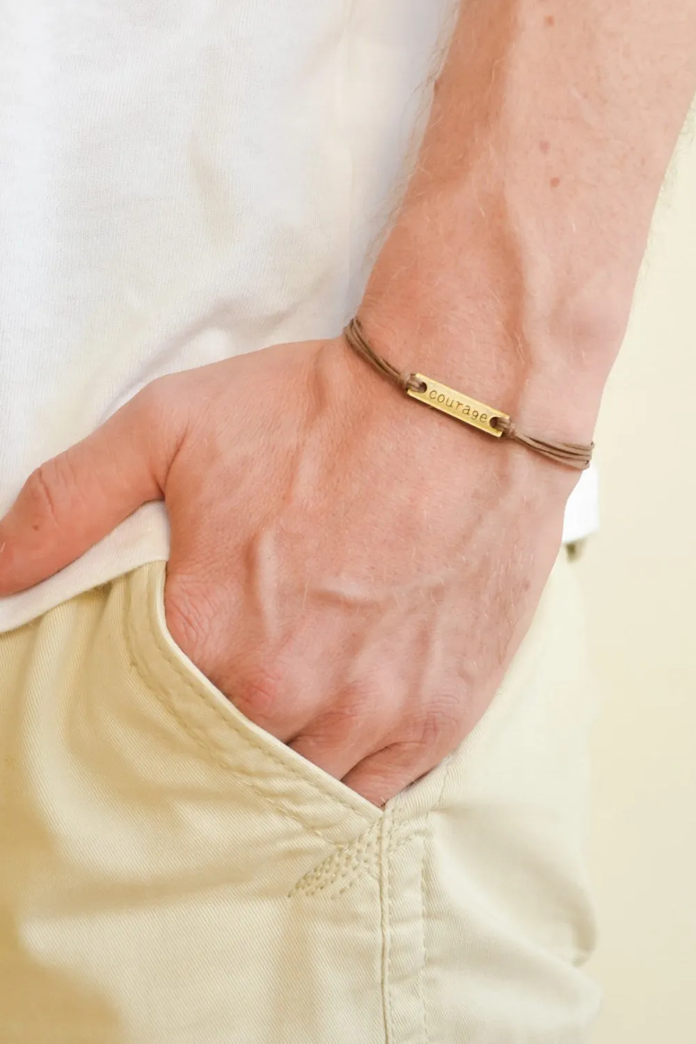 Bronze tone Courage bracelet for men, brown cord