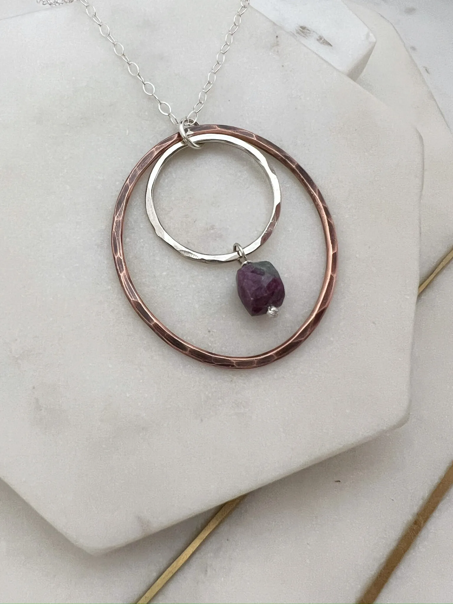 Sterling silver and copper forged hoop necklace with ruby zosite